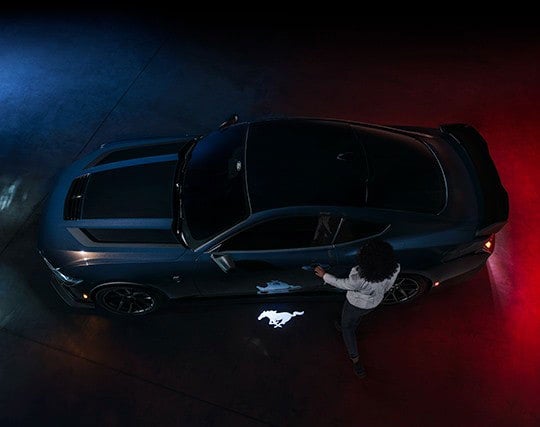 2024 Ford Mustang® Dark Horse™ model with a driver approaching the vehicle | White Ford Lincoln, L.L.C. in Winnsboro LA