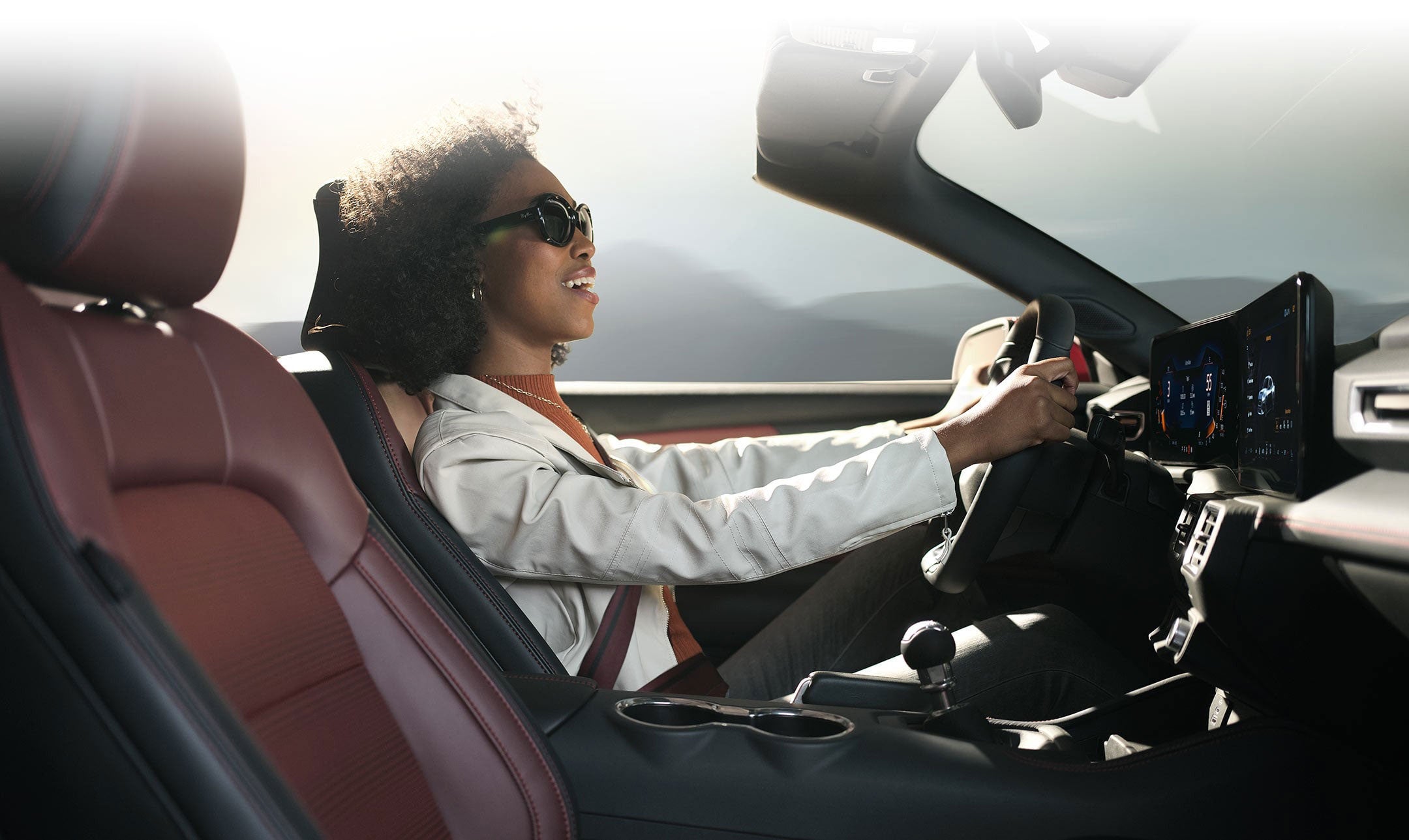 Person sitting in the driver’s seat of a 2024 Ford Mustang® convertible | White Ford Lincoln, L.L.C. in Winnsboro LA